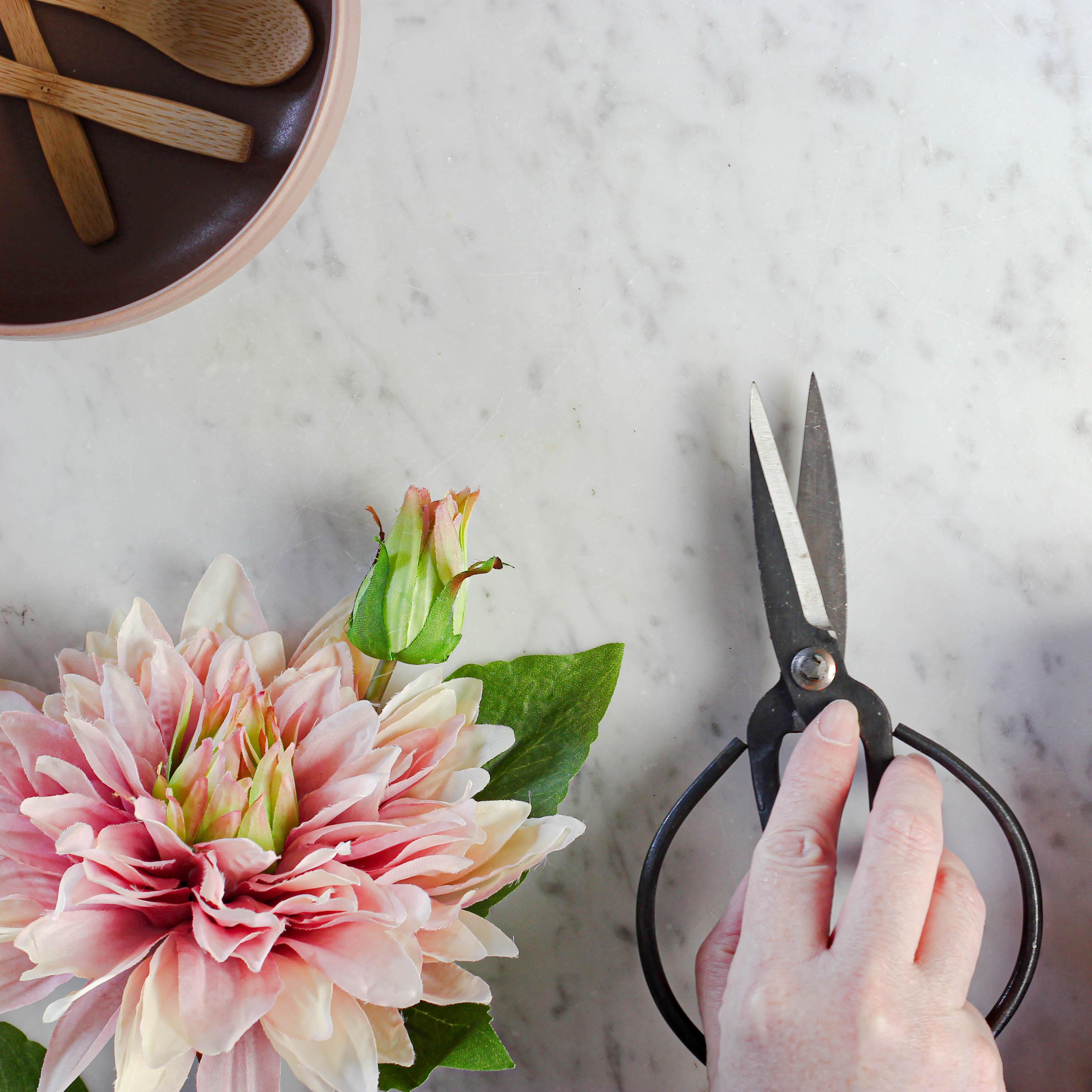 hand holding a florist scissors